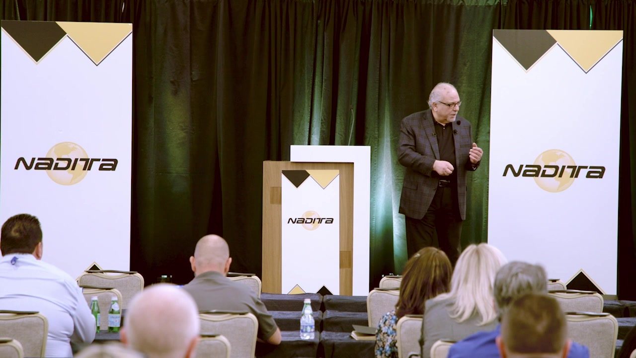 Dom "The Dominator" LoRiggio presenting a casino education talk to a seated conference audience